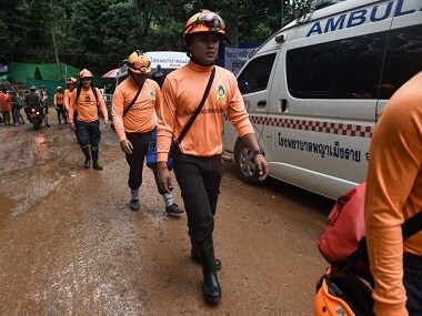 Workers at the Tham Luang cave in Thailand on their mission to rescue the 12 boys and their coach trapped since 23 June. AFP