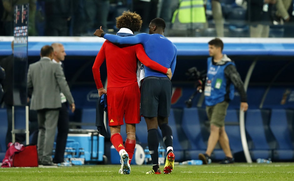 Marouane Fellaini (L) is comforted by club teammate Paul Pogba after the latter's side, France, edged past Belgium. AFP Marouane Fellaini (L) is comforted by club teammate Paul Pogba after the latter's side, France, edged past Belgium. AFP