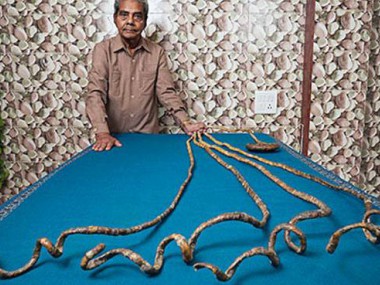 Indian octogenarian with world's longest fingernails set to cut coiled appendages in New York ceremony Indian octogenarian with world's longest fingernails set to cut coiled appendages in New York ceremony