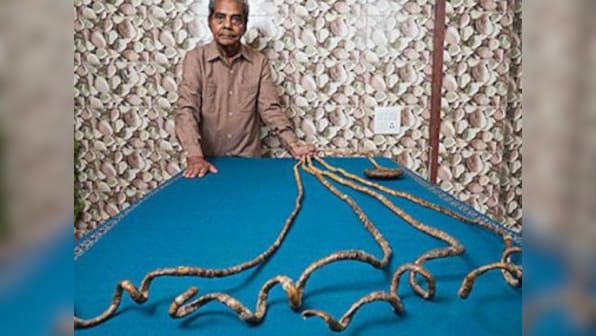 Indian octogenarian with world's longest fingernails set to cut coiled appendages in New York ceremony
