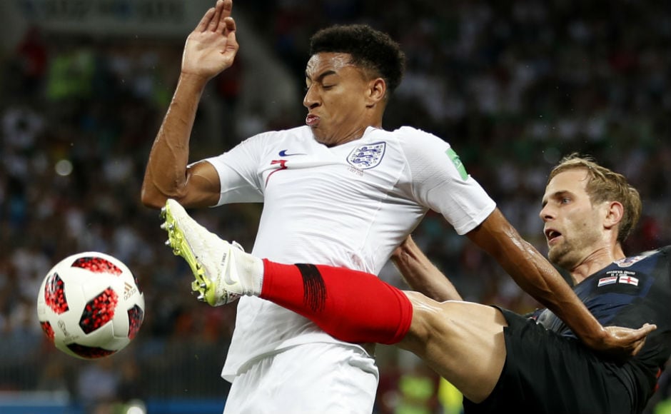England's Jesse Lingard and Croatia's Ivan Strinic fight for the ball. AP England's Jesse Lingard and Croatia's Ivan Strinic fight for the ball. AP