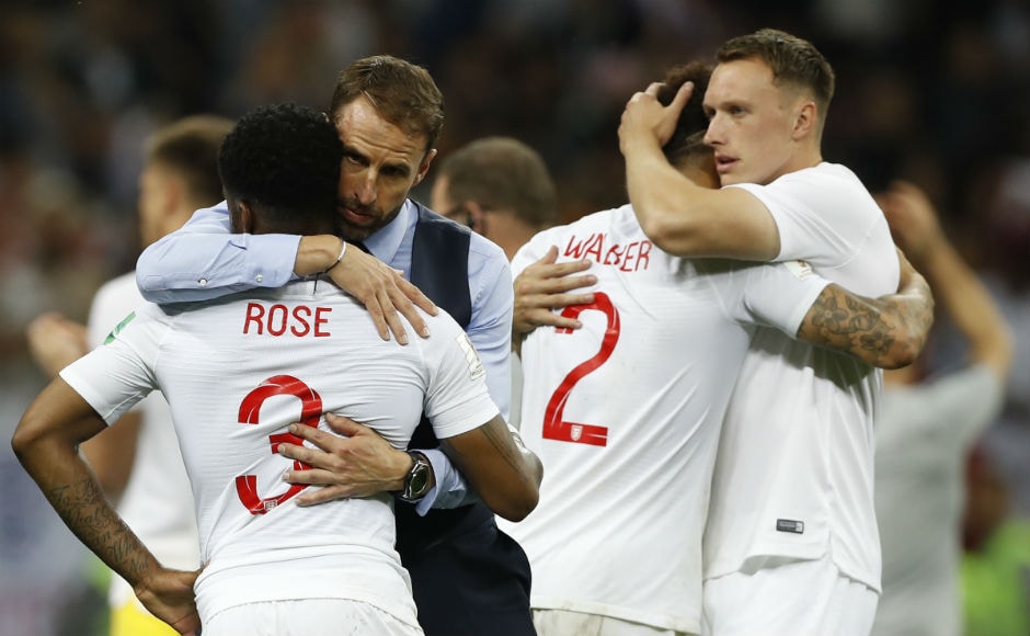 England manager Gareth Southgate hugs his team members at the end of their match against Croatia. England manager Gareth Southgate hugs his team members at the end of their match against Croatia.