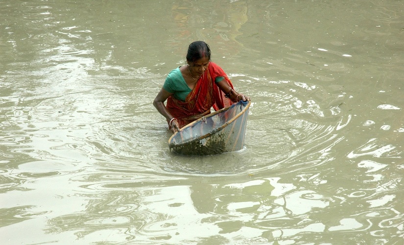 A woman fishing in waist deep water in a farm pond in Ranchi. Image courtesy Debjani Chakraborty