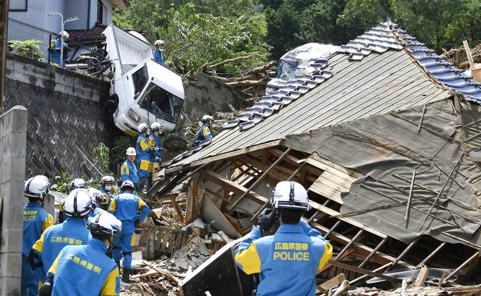 Some homes were smashed. Others were tilting precariously. Rivers overflowed, turning towns into lakes, leaving dozens of people stranded on rooftops. AP