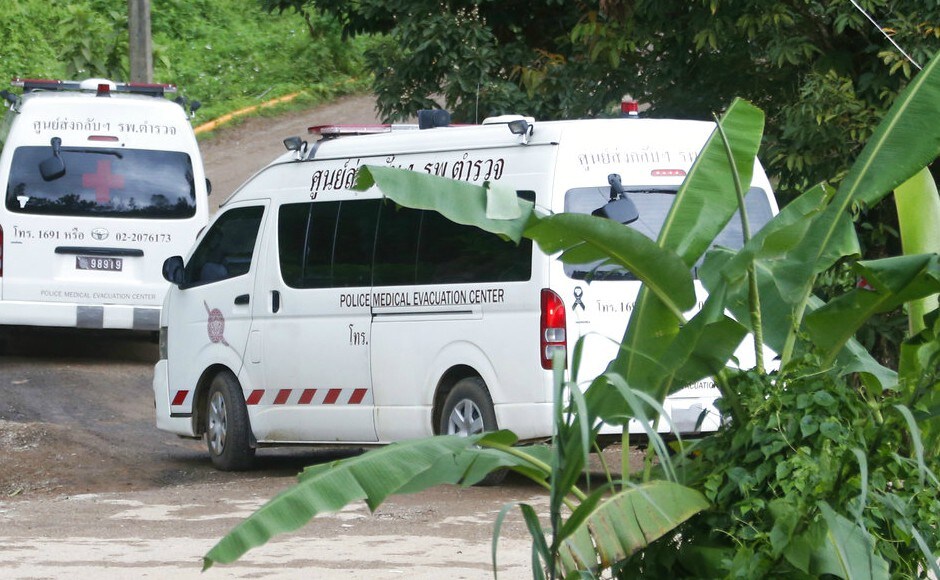 Two ambulances arrive near the cave to wait for more evacuations of the boys and their soccer coach. AP