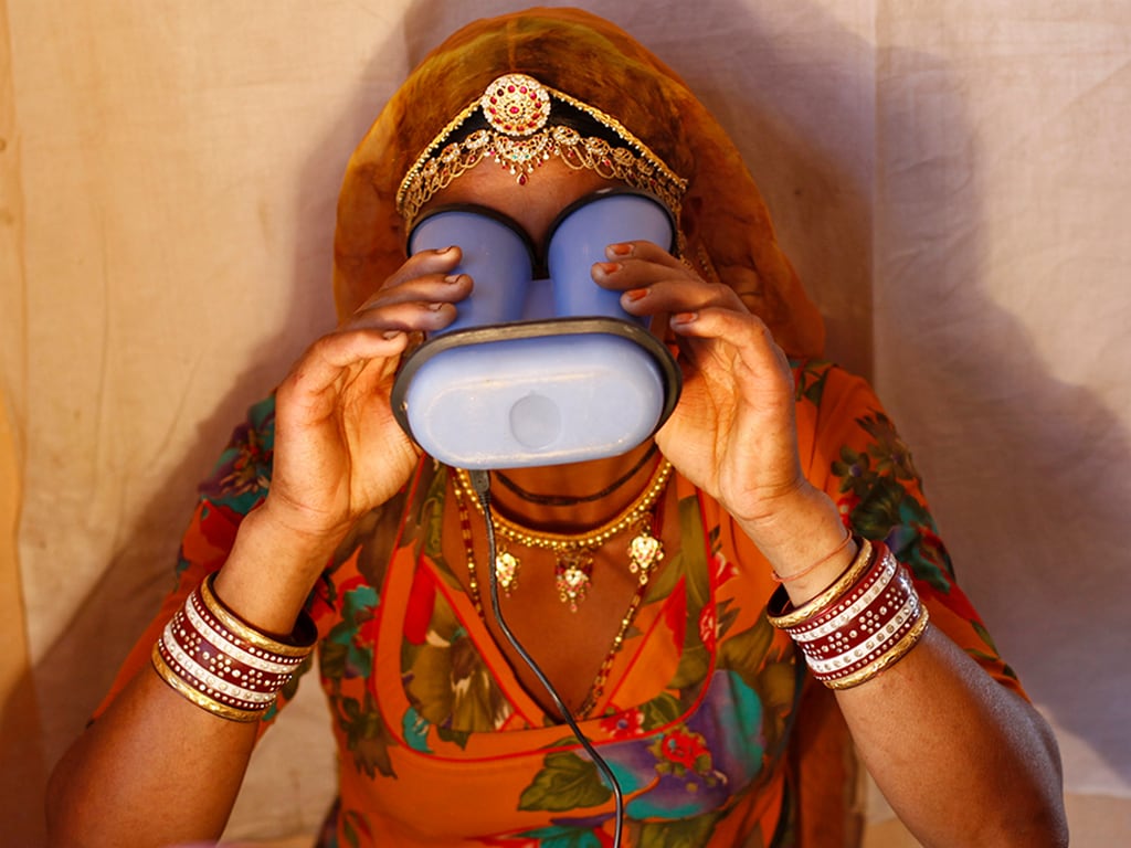 Woman using an iris scanner for UIDAI Aadhaar registration. Image: Reuters
