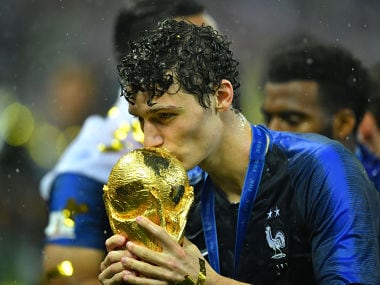Soccer Football - World Cup - Final - France v Croatia - Luzhniki Stadium, Moscow, Russia - July 15, 2018 France's Benjamin Pavard kisses the trophy as he celebrates winning the World Cup REUTERS/Dylan Martinez - RC13A1FCF2F0