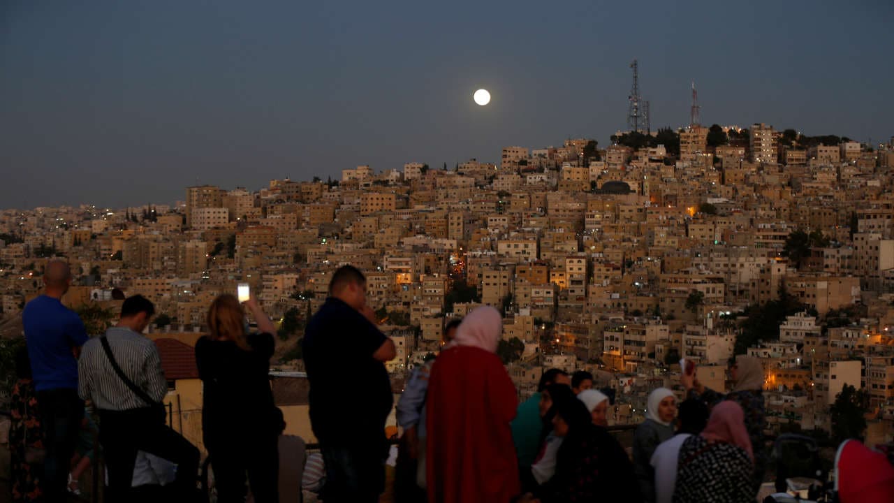 People gathered with their loved ones to catch a glimpse of the blood moon all over the world, like here at the Amman Citadel. Location: Jordan, Image: Reuters People gathered with their loved ones to catch a glimpse of the blood moon all over the world, like here at the Amman Citadel. Location: Jordan, Image: Reuters