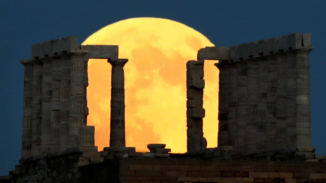 Its beauty was overwhelming and its vastness, intimidating. It looked like a jewel, or like a huge orange hanging in the sky. Location: Greece, Image: Reuters Its beauty was overwhelming and its vastness, intimidating. It looked like a jewel, or like a huge orange hanging in the sky. Location: Greece, Image: Reuters