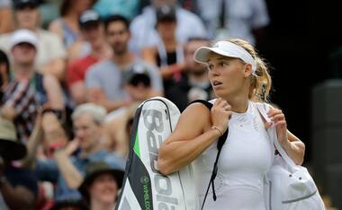 Second seed Caroline Wozniacki crashes out of Wimbledon in Round of 64; Roger Federer, Serena Williams cruise to victory