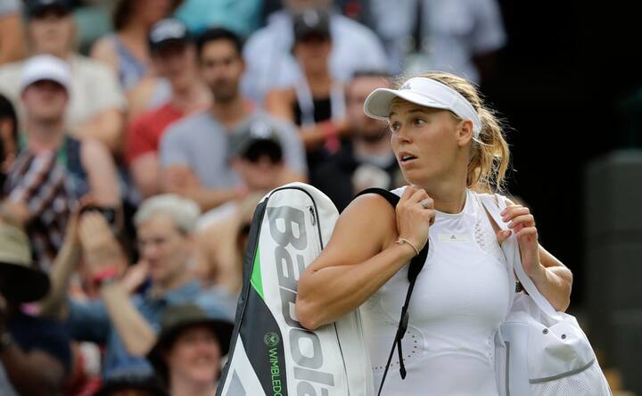 Second seed Caroline Wozniacki crashes out of Wimbledon in Round of 64; Roger Federer, Serena Williams cruise to victory Second seed Caroline Wozniacki crashes out of Wimbledon in Round of 64; Roger Federer, Serena Williams cruise to victory