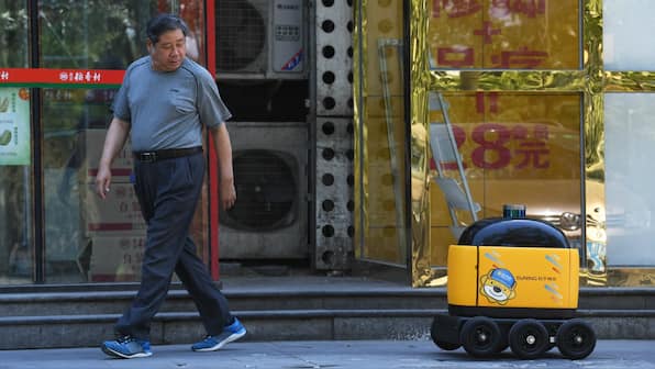 'Little yellow horse': How autonomous robots are delivering essentials in China