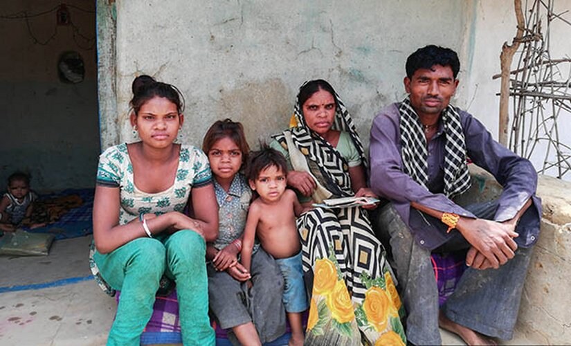 Mahesh and Phulkali Kol with their children. Ruby, 3, centre, is malnourished and often falls sick.