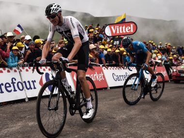 Tour de France: Chris Froome's race almost ends as policeman knocks him off bike after mistaking him for fan Tour de France: Chris Froome's race almost ends as policeman knocks him off bike after mistaking him for fan