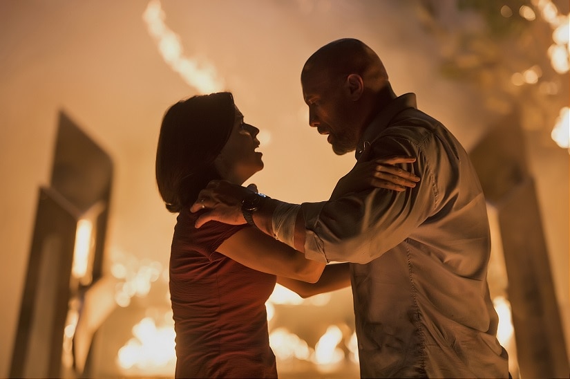 Neve Campbell and Dwayne Johnson in Skyscraper. Image via Twitter