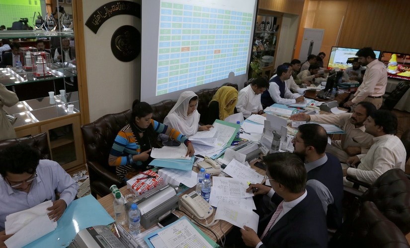 Pakistan Election Commission staff compile official results of general elections. AP