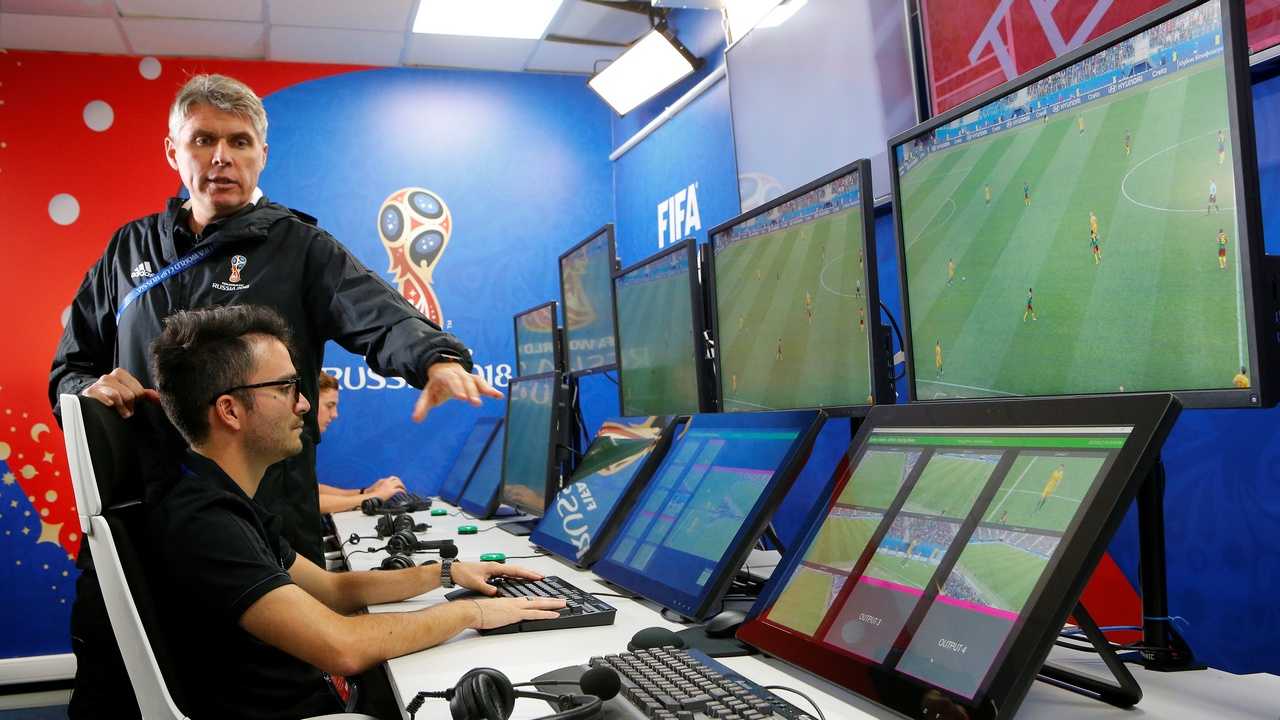 FIFA VAR Refereeing Project Leader Roberto Rosetti (top) demonstrates a video operation room (VOR), a facility of the Video Assistant Referee (VAR) system. Image: Reuters 