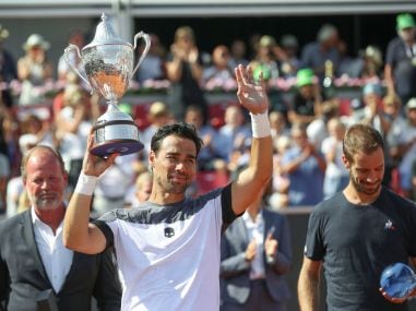 Fabio Fognini celebrates with the trophy after winning the final against Richard Gasquet. Reuters