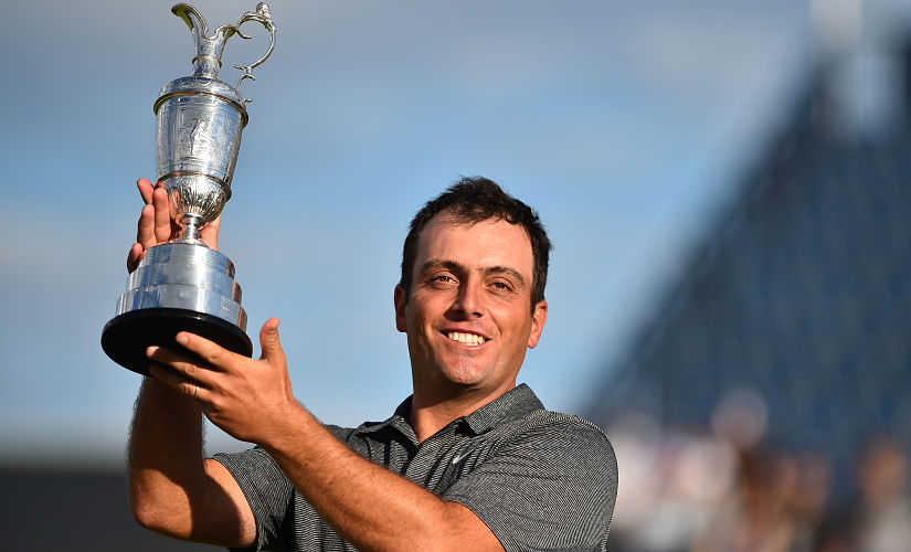 Italy's Francesco Molinari poses for pictures with the Claret Jug, the trophy for the Champion golfer of the year after winning the 147th Open golf Championship at Carnoustie, Scotland on July 22, 2018. Italy's Francesco Molinari won the British Open by 2 shots after shooting a four round total of 276, 8 under par. / AFP PHOTO / Glyn KIRK