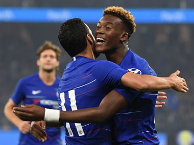 Chelsea's Callum Hudson-Odoi (R) celebrates with teammate Pedro after his cross helped in scoring his team's first goal against Perth Glory during their friendly football match at Optus stadium in Perth on July 23, 2018. / AFP PHOTO / Greg Wood / -- IMAGE RESTRICTED TO EDITORIAL USE - STRICTLY NO COMMERCIAL USE --