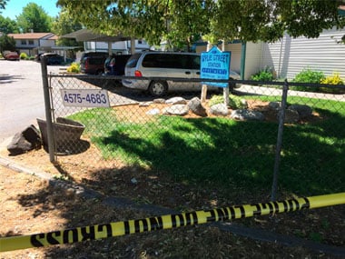 Police tape blocks off an area at a Boise, Idaho, apartment complex on Sunday. AP