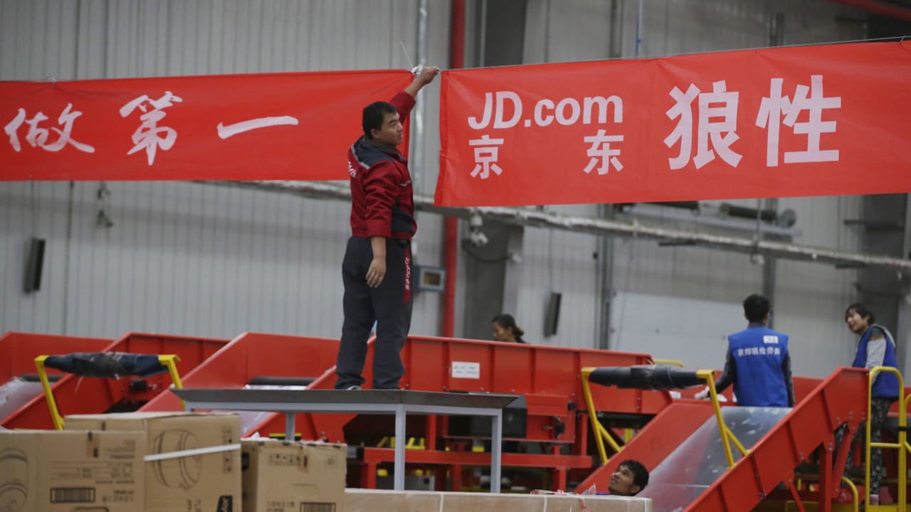 An employee works at a JD.com logistic centre in Langfang, Hebei province, November 10, 2015. On China's giant Singles Day internet shopping festival, the country's delivery firms are stretched so thin that they are looking for tie-ups, listings and new investors to husband their resources. E-commerce has been a huge boon to the logistics industry, but the ever-bigger Singles Day, run by leading online market company Alibaba Group Holding Ltd on Nov. 11 every year, exacerbates the industry's twin dilemmas of cut-throat competition and rising labor costs. With low barriers to entry, express couriers proliferated rapidly over the past decade to more than 8,000 firms, squeezing profit margins to about 5 percent, down from 30 percent 10 years ago, according to analysts. To match CHINA-SINGLES DAY/LOGISTICS REUTERS/Jason Lee - GF20000053038