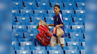 FIFA World Cup 2018: Japan team cleans out locker room, fans stay back to help stadium workers after devastating defeat