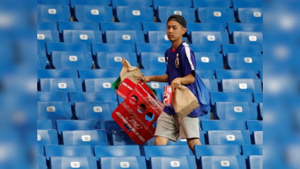 FIFA World Cup 2018: Japan team cleans out locker room, fans stay back to help stadium workers after devastating defeat