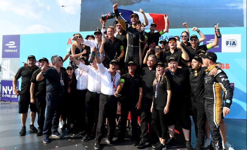 Jean-Eric Vergne celebrates on the podium with the Techeetah Formula E Team after winning the championship. Image courtesy: Techeetah Formula E Team