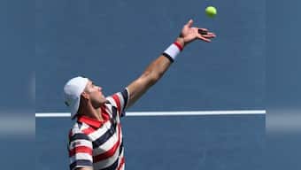 New York Open: John Isner defeats Bernard Tomic in straight sets to advance to quarter-final