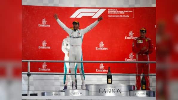 German Grand Prix: Mercedes' Lewis Hamilton wins chaotic, wet race as Sebastian Vettel's mistake costs him dear