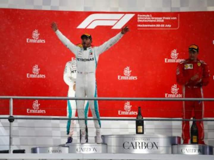 German Grand Prix: Mercedes' Lewis Hamilton wins chaotic, wet race as Sebastian Vettel's mistake costs him dear