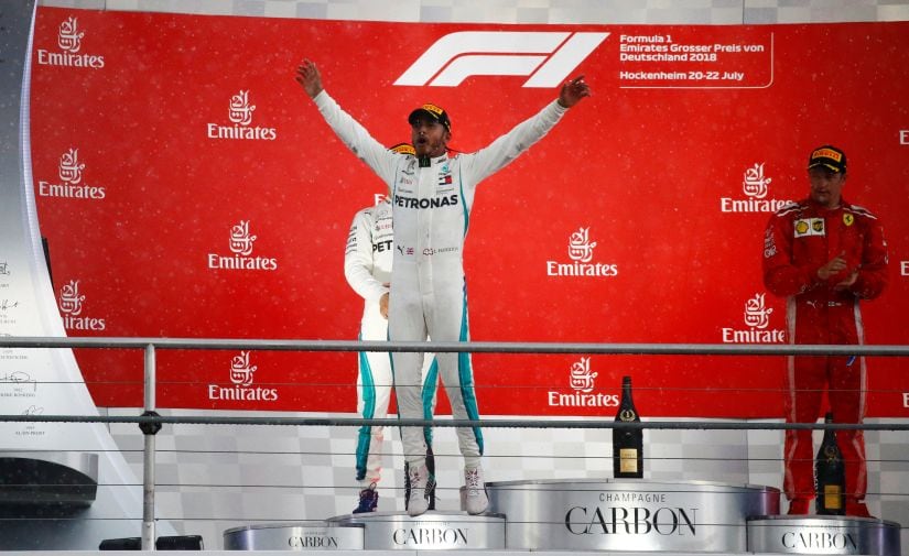   Lewis Hamilton, of Mercedes, celebrates on the podium after winning the Grand Prix of Germany. Reuters 