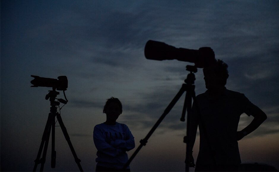 People wait beside their cameras to take photos of the full moon in Ujue, northern Spain. Amateur astronomers in the southern hemisphere were best-placed to witness the rare sight, especially in southern Africa, Australia, and Madagascar, though it was also visible in Europe, South Asia and South America. AP People wait beside their cameras to take photos of the full moon in Ujue, northern Spain. Amateur astronomers in the southern hemisphere were best-placed to witness the rare sight, especially in southern Africa, Australia, and Madagascar, though it was also visible in Europe, South Asia and South America. AP