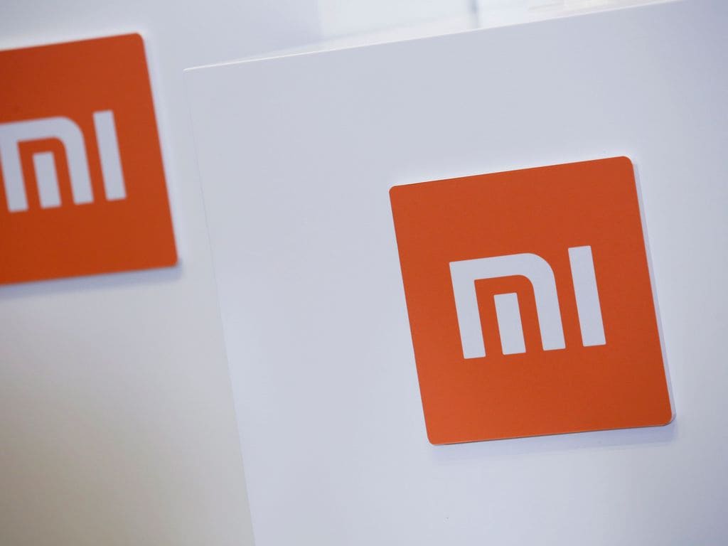 Xiaomi logos are seen during a news conference. Image: Reuters