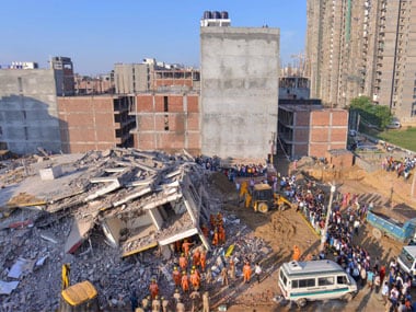 NDRF and local authorities carry out rescue work at the site of a collapsed building at Shahberi village, in Greater Noida. PTI