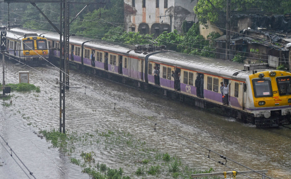 Local trains, considered the lifeline of Mumbai, on Tuesday moved at the snail's pace due to water-logging of the tracks, resulting in harrowing times for<br />lakhs of office-goers and other commuters. PTI Local trains, considered the lifeline of Mumbai, on Tuesday moved at the snail's pace due to water-logging of the tracks, resulting in harrowing times for<br />lakhs of office-goers and other commuters. PTI