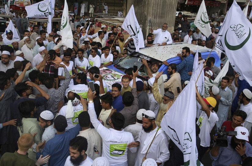 Supporters of 'Jamaat-e-Islami' religious party in Karachi. AP