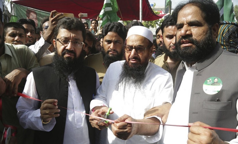 Jamaat-ud-Dawa chief Mohamad Hafiz Saeed inaugurates an election office of the newly formed political party Allah-o-Akbar Tehreek in Lahore, Pakistan. AP