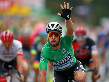 Slovakia's Peter Sagan, wearing the best sprinter's green jersey, celebrates as he crosses the finish line to win the thirteenth stage of the Tour de France cycling race over 169.5 kilometers (105.3 miles) with start in Bourg d'Oisans and finish in Valence, France, Friday July 20, 2018. (AP Photo/Peter Dejong)