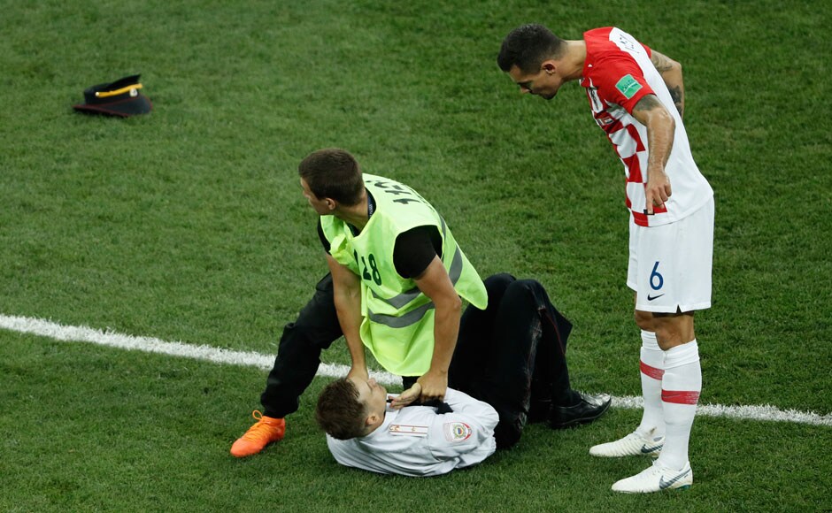 Croatia turned it up a notch after conceding for the second time, but their momentum was disrupted when a group of individuals invaded the pitch and lead the stewards on a walkabout. AFP Croatia turned it up a notch after conceding for the second time, but their momentum was disrupted when a group of individuals invaded the pitch and lead the stewards on a walkabout. AFP