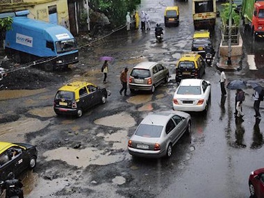 Potholes in Mumbai: Woman sustains head injuries after falling off scooter in Tardeo, condition stable says doctor Potholes in Mumbai: Woman sustains head injuries after falling off scooter in Tardeo, condition stable says doctor