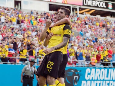 Borussia Dortmund's Christian Pulisic scores his second goal against Liverpool. Twitter: @BVB