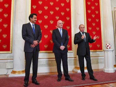Qatar Emir Sheikh Tamim bin Hamad al-Thani, FIFA president Gianni Infantino and Vladimir Putin attend a handover ceremony for the 2022 World Cup. Reuters