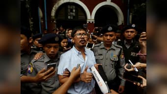 Reuters journalists to face trial for breaching Mayanmar's secrecy law; scribes were investigating massacre of Rohingya Muslims