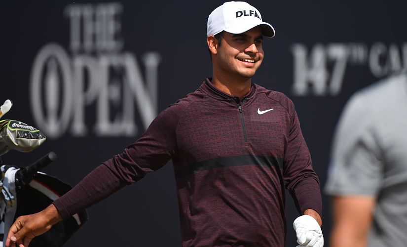 India's Shubhankar Sharma leaves the 1st tee during his first round on day one of The 147th Open golf Championship at Carnoustie, Scotland on July 19, 2018. / AFP PHOTO / Andy BUCHANAN