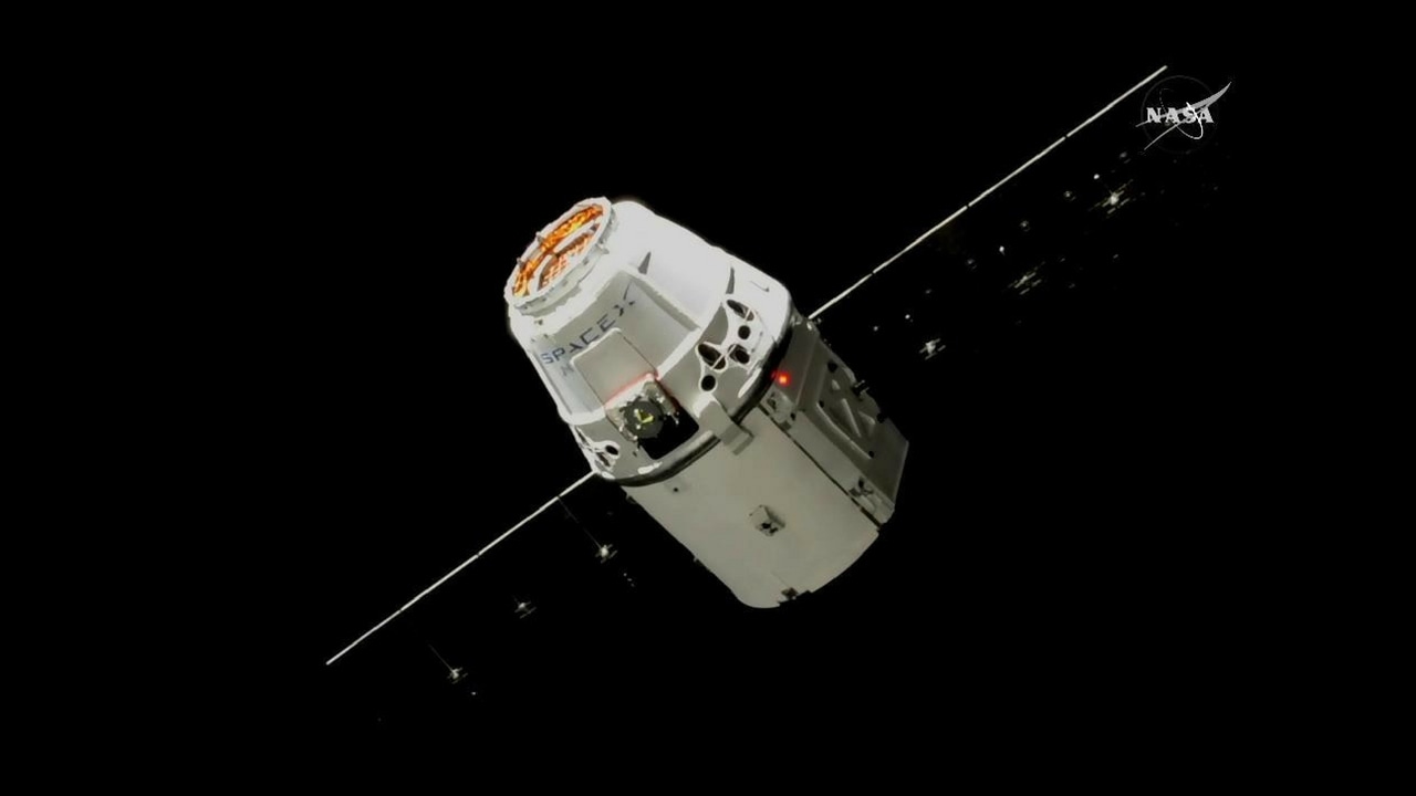 The SpaceX Dragon, pictured 30 meters from the International Space Station. Image courtesy: NASA TV