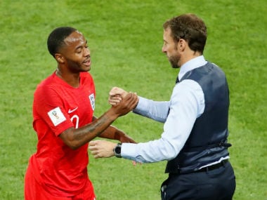 England's Raheem Sterling with coach Gareth Southgate. AFP