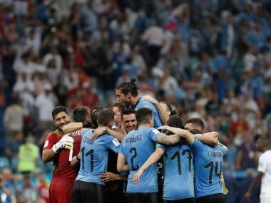   Uruguayan players celebrate their victory against Portugal. AFP 