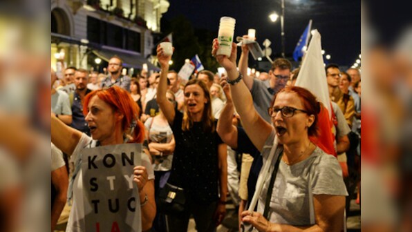 Thousands march towards Warsaw presidential palace to protest reforms to Polish judiciary